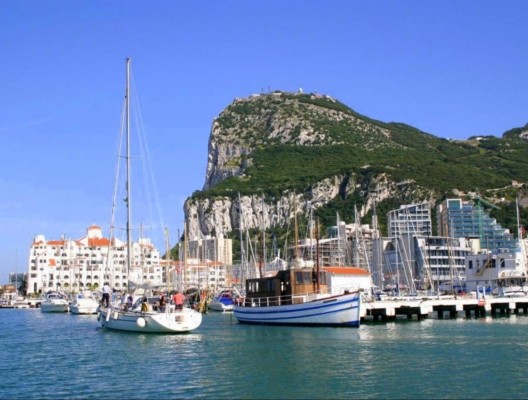 Boats in the harbour in front of Gibraltar Rock