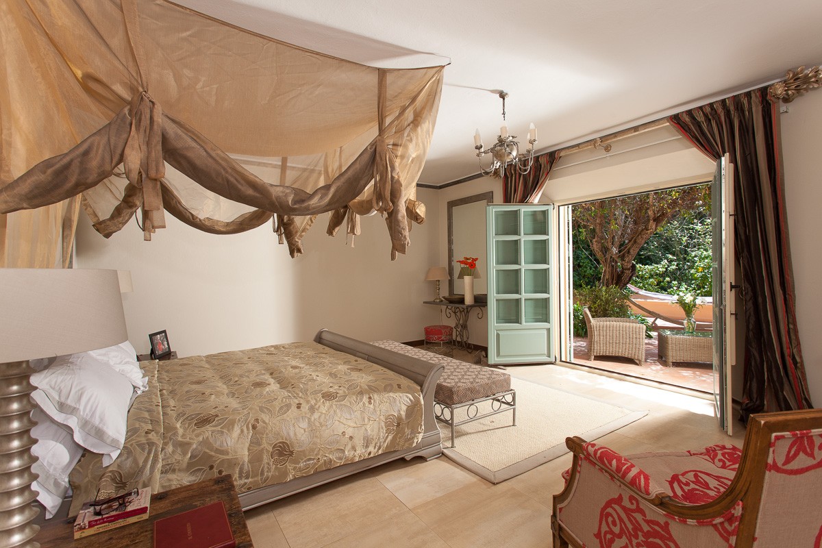 Master suite opening to villa terrace Cortijo master bedroom suite