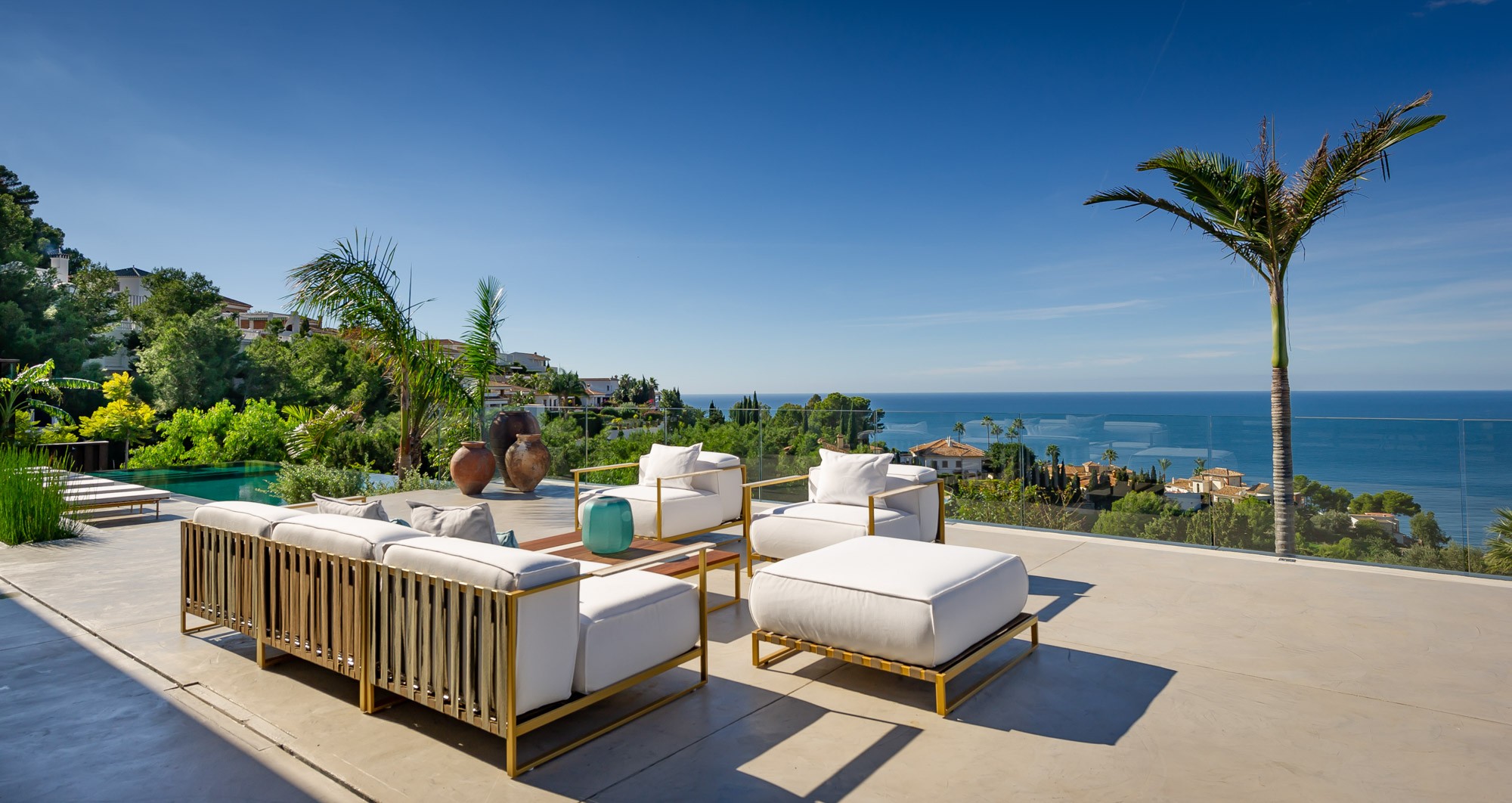 Seating on villa terrace with sea views