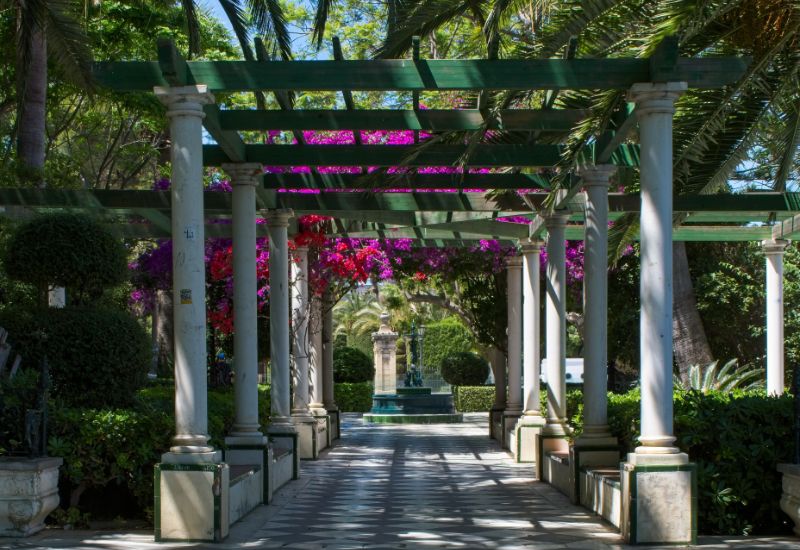 Shadey floral walkway in a city park in Cadiz
