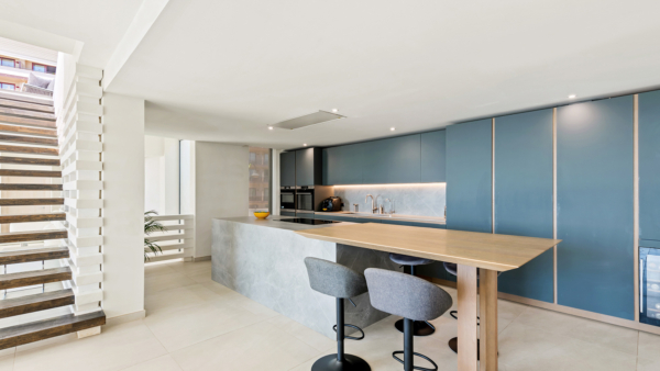 Sleek Contemporary Navy Blue Kitchen with Breakfast Bar