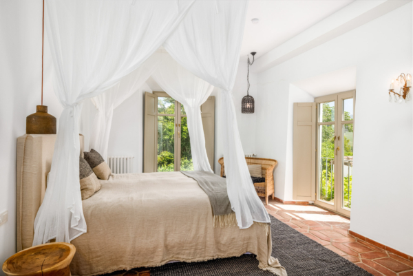 Guest bedroom with dual aspect french doors