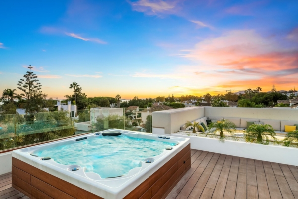 Rooftop hot tub at sunset
