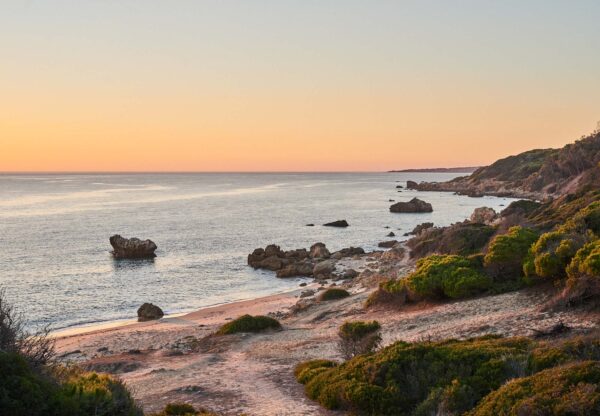 Private access to secluded beach at dusk